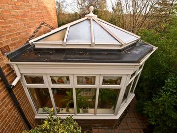 Miss A. Lower Heswall, Wirral : Design and build orangery. quanta Aluminium lantern light glazed with Celsius clear double glazed units. Firestone roof covering. Feature PvcU Fascia. 2800 white PvcU frames double glazed with Hytherm sealed units. 